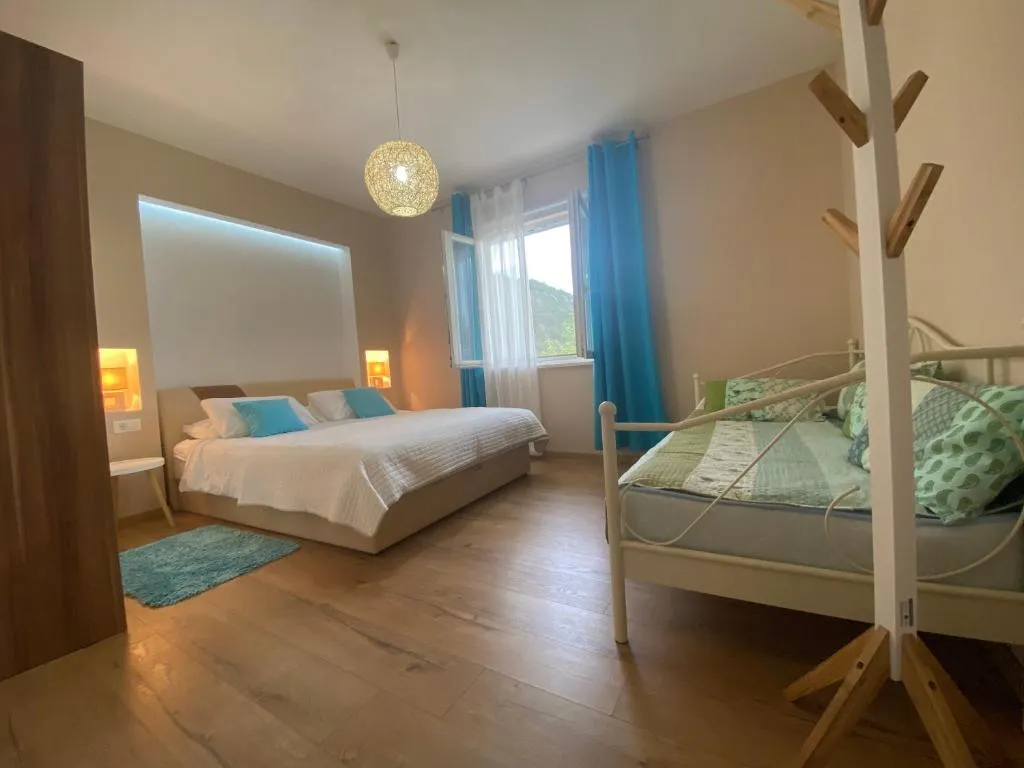 Bright bedroom at Villa Betty with hill view
