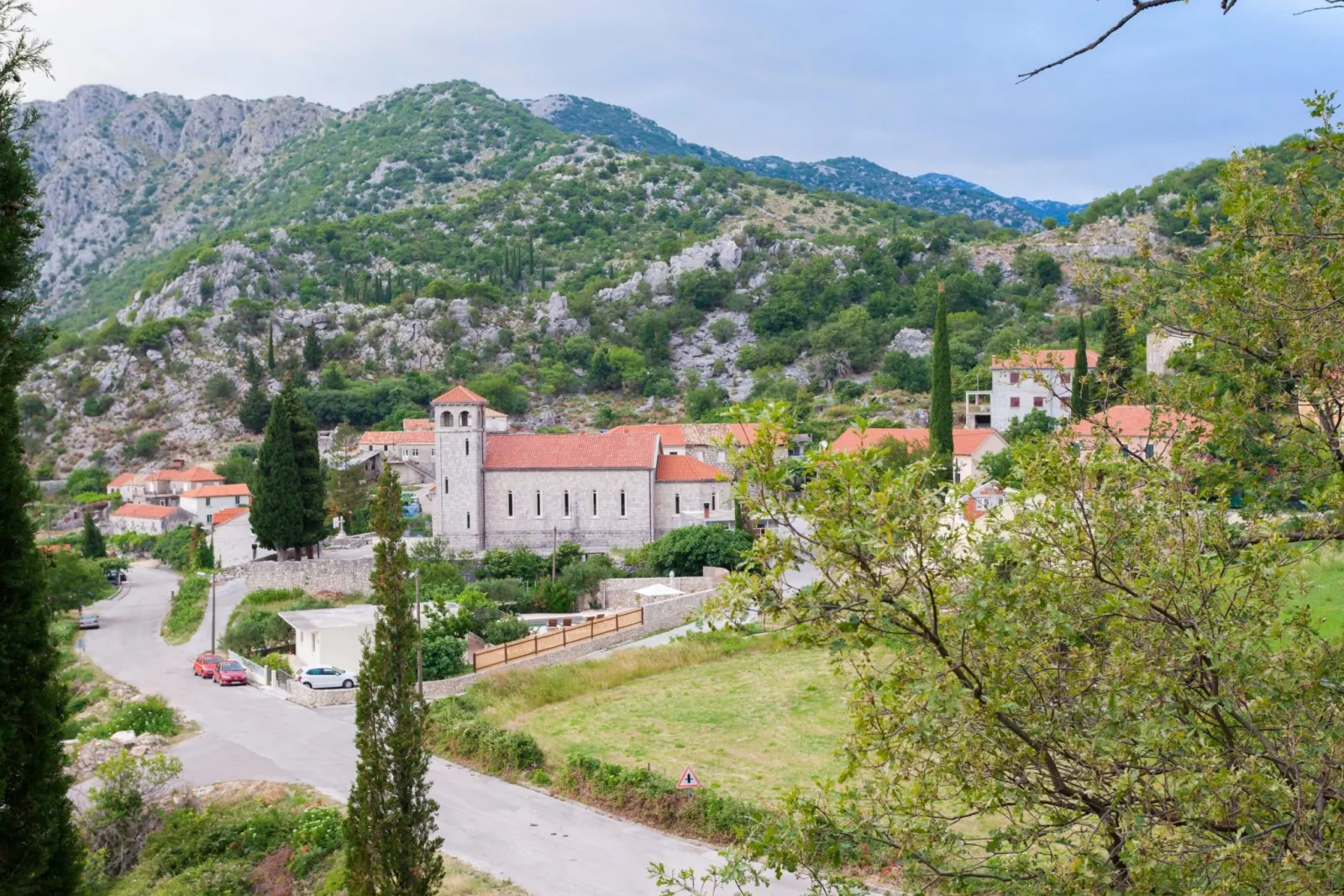 View over Dubravka village in Konavle, with the parish church and hills